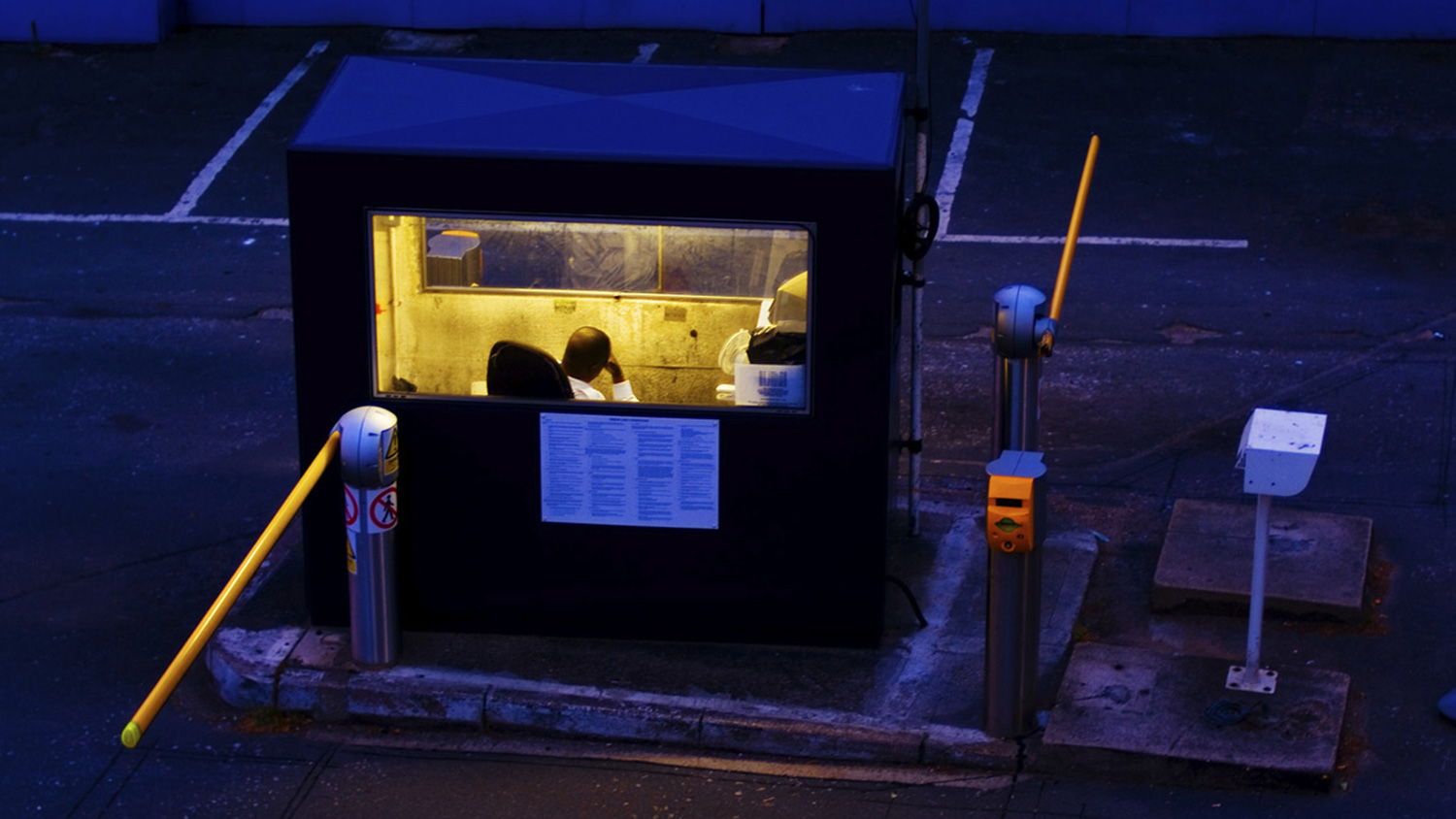 A night worker sits in a booth