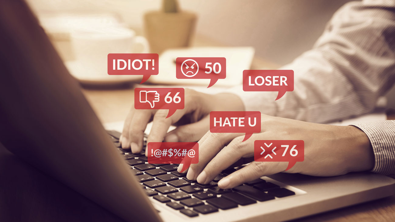 An employee sends cyberbullying messages via social media