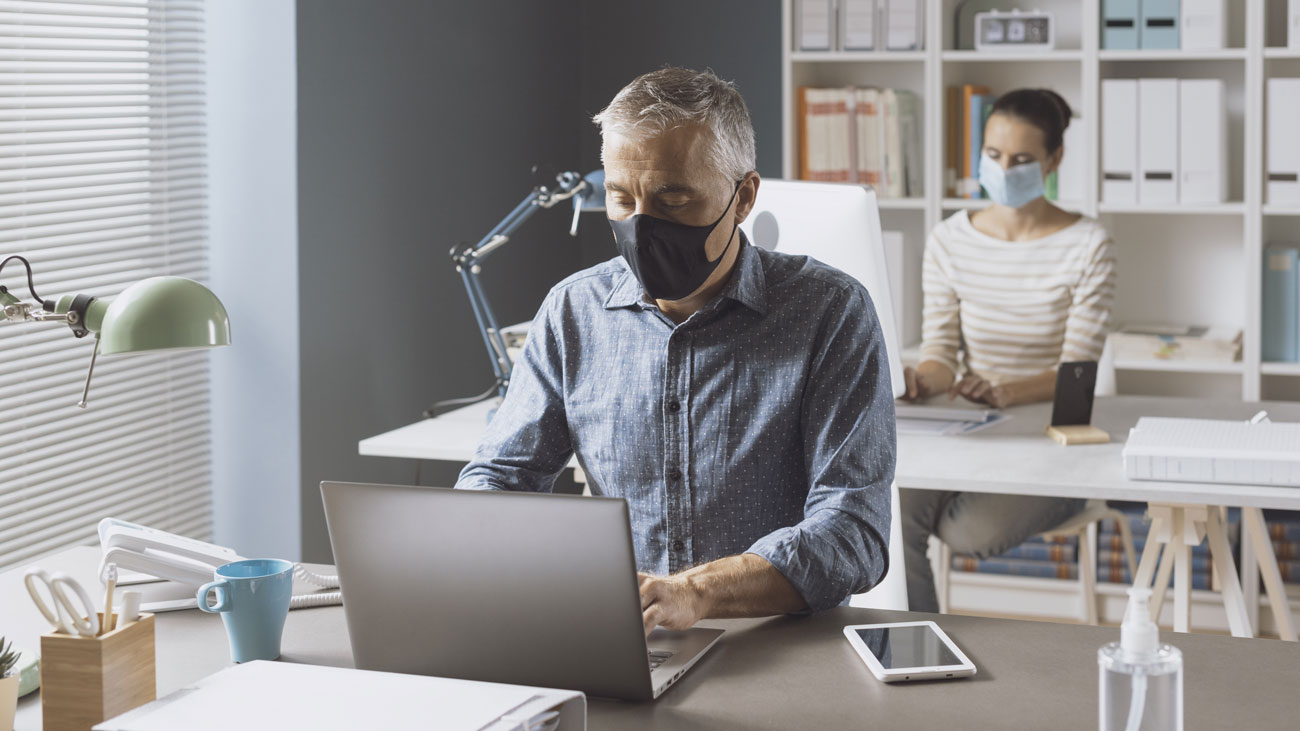 Office workers in face masks