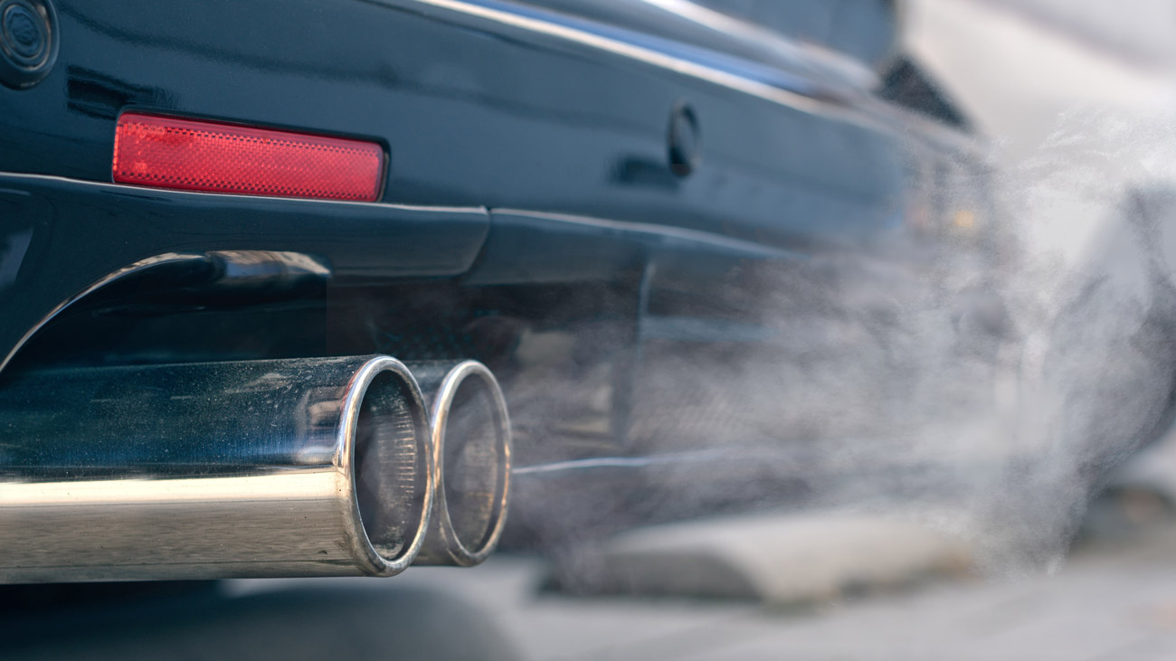 close-up-of-smoky-dual-exhaust-pipes-from-a-starting-diesel-car-1300pxs.jpg