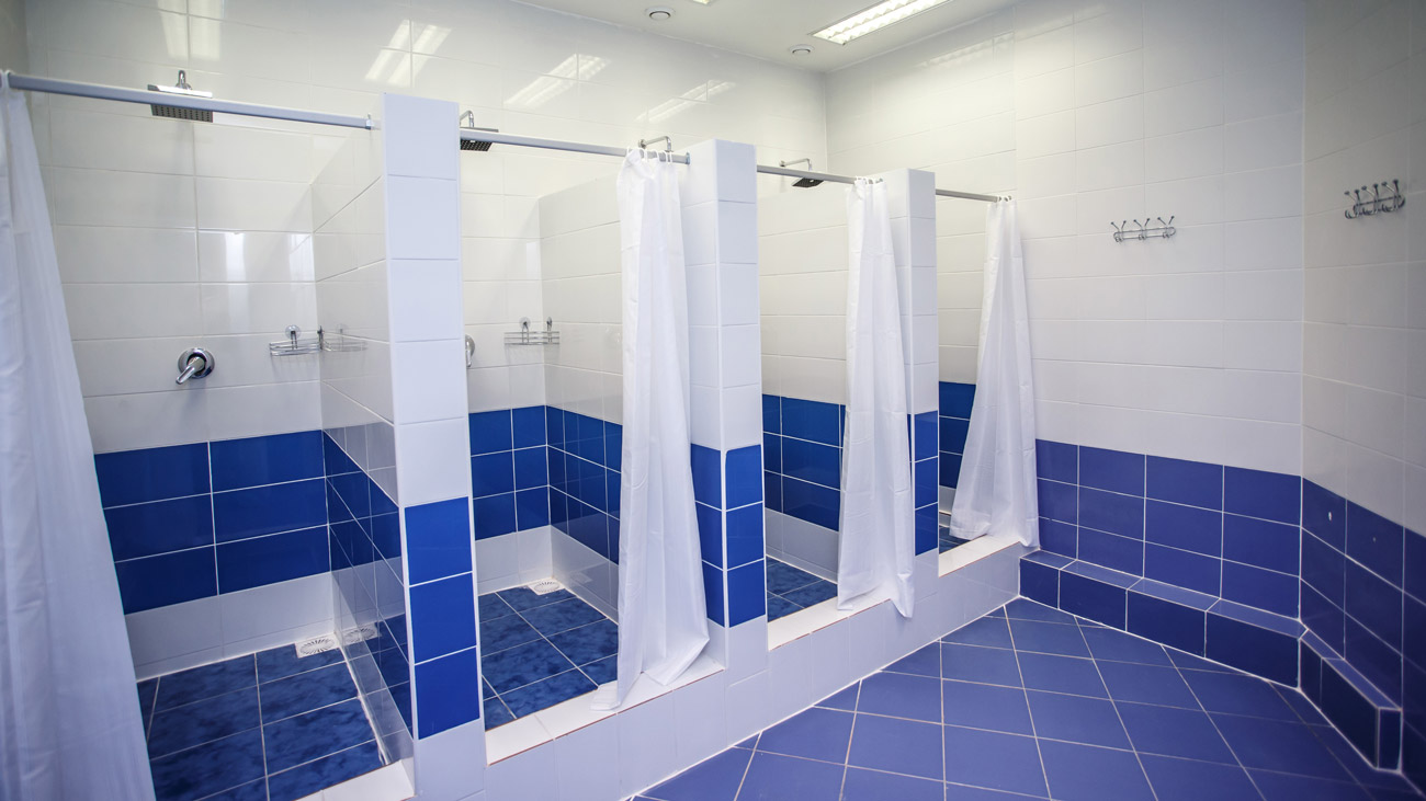 A row of shower stalls