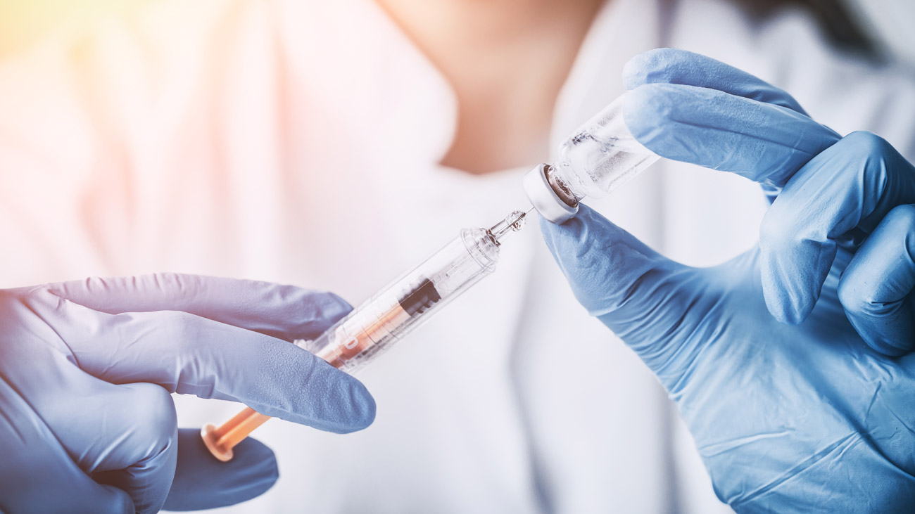 A nurse injecting a vaccine